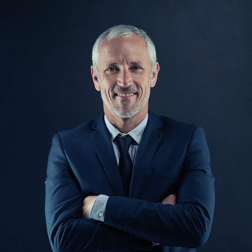 Studio portrait of a mature businessman against a dark backgroun tengb